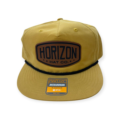 Biscuit and black Horizon rope cap with a rawhide-colored logo patch