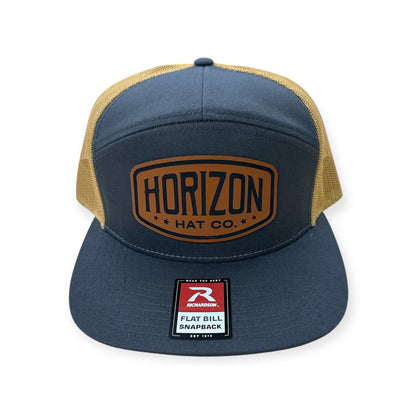 Charcoal and gold Horizon cap with a tan logo patch