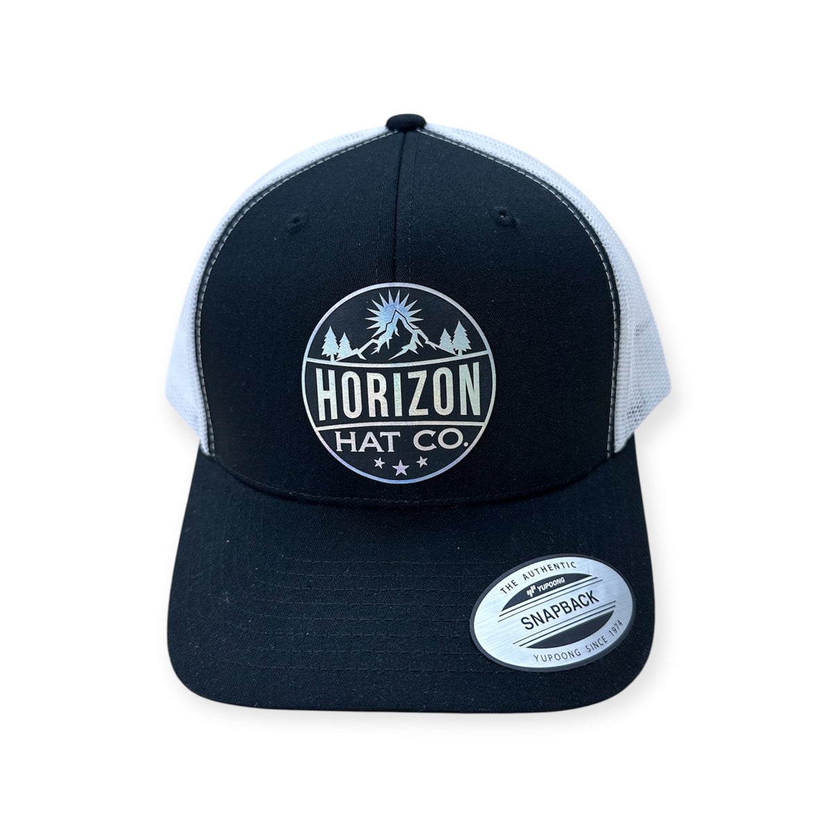 Black and white Horizon cap with a reversed holographic logo patch