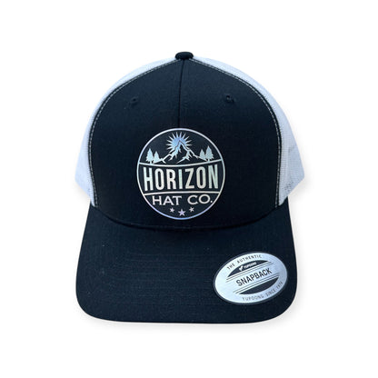 Black and white Horizon cap with a reversed holographic logo patch
