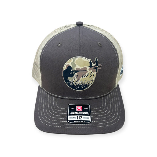 Front view of Duck Hunt patch hat by Horizon Hat Co. in brown/khaki showing camouflage patch depicting a duck hunter taking aim