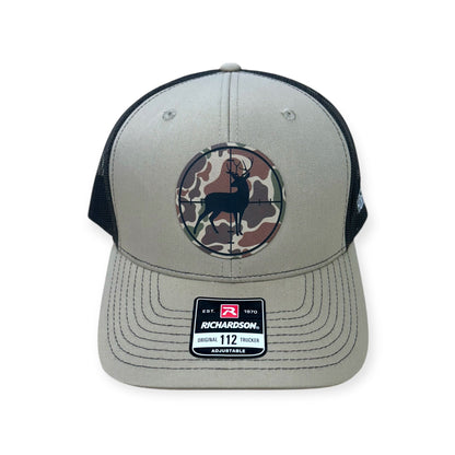 Front view of Deer Scope patch hat by Horizon Hat Co. in khaki/coffee showing deer seen through a scope on a camouflage patch