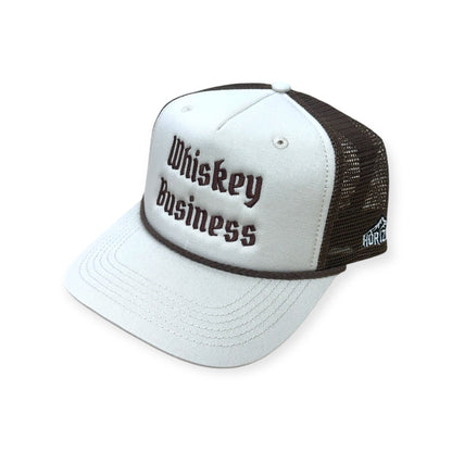 Angled view of Whiskey Business embroidered cap by Horizon Hat Co. in sand/chocolate showing the bill and side panels