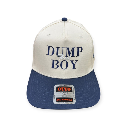 Front view of Dump That Boy embroidered cap by Horizon Hat Co. in natural/navy showing dump that boy front embroidery