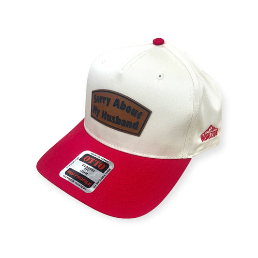 Angled view of Sorry About My Husband patch hat by Horizon Hat Co. in natural/red showing the bill and side panels