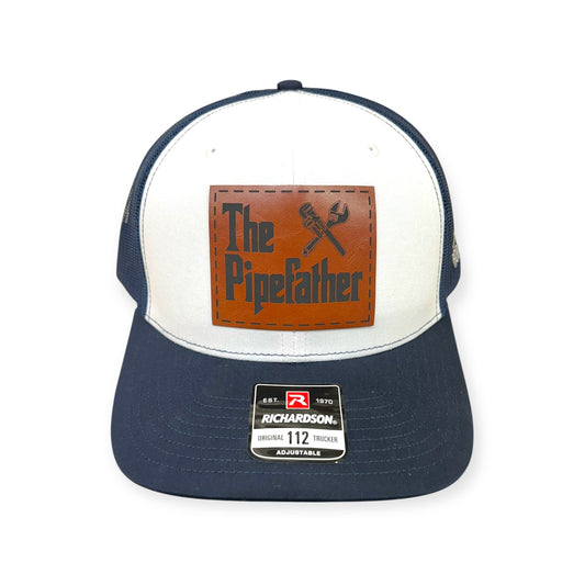 Front view of The Pipefather patch hat by Horizon Hat Co. in navy/white/navy showing plumbing-themed pipefather patch