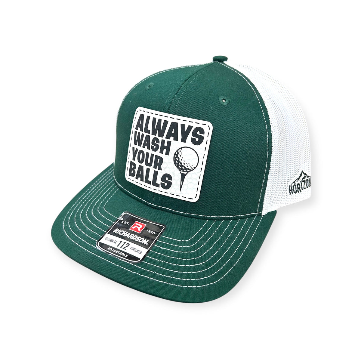 Angled view of Always Wash Your Balls patch hat by Horizon Hat Co. in dark green/white showing the curved bill and side panels