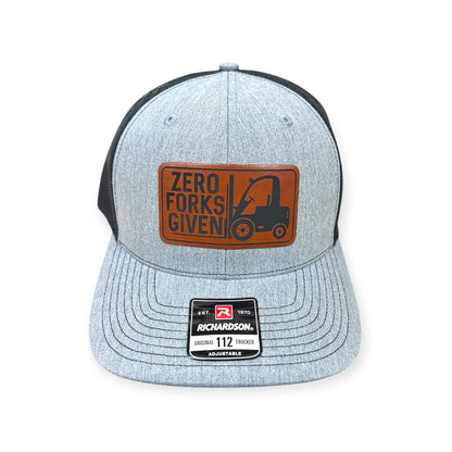 Front view of Zero Forks Given patch hat by Horizon Hat Co. in heather gray/black showing forklift illustration and workplace-humor lettering