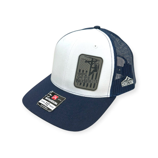 Angled view of Support Your Local Pole Dancer patch hat by Horizon Hat Co. in white/navy showing the bill and side panels