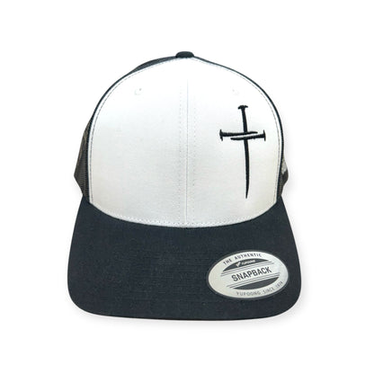 Front view of Nailed to the Cross embroidered cap by Horizon Hat Co. in white/black showing embroidered cross made from nails