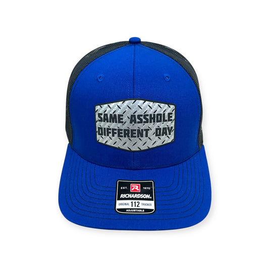 Front view of Same Asshole, Different Day patch hat by Horizon Hat Co. in royal blue/black showing adult-humor same asshole, different day patch