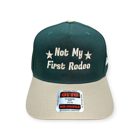 Front view of Not My First Rodeo embroidered cap by Horizon Hat Co. in green/natural showing not my first rodeo embroidery with stars
