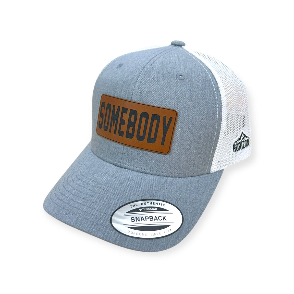 Angled view of Somebody patch hat by Horizon Hat Co. in heather gray/white showing the bill and side panels