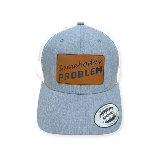 Front view of Somebody's Problem patch hat by Horizon Hat Co. in heather gray/white showing somebody's problem statement patch
