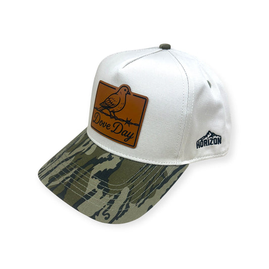 Angled view of Dove Day patch hat by Horizon Hat Co. in white/camouflage bill showing the bill and side panels