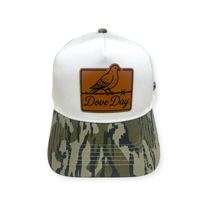 Front view of Dove Day patch hat by Horizon Hat Co. in white/camouflage bill showing dove perched on a fence on a front patch