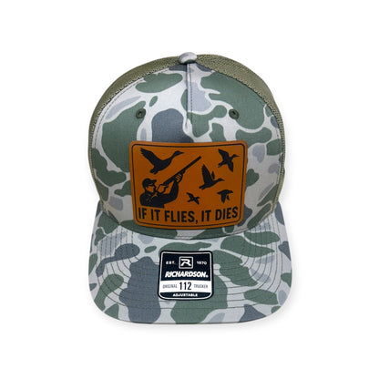 Front view of If It Flies, It Dies patch hat by Horizon Hat Co. in camouflage showing hunter and birds in flight on a front patch