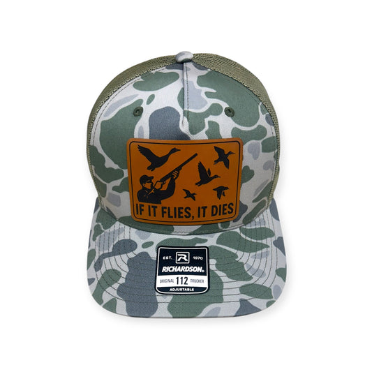 Front view of If It Flies, It Dies patch hat by Horizon Hat Co. in camouflage showing hunter and birds in flight on a front patch