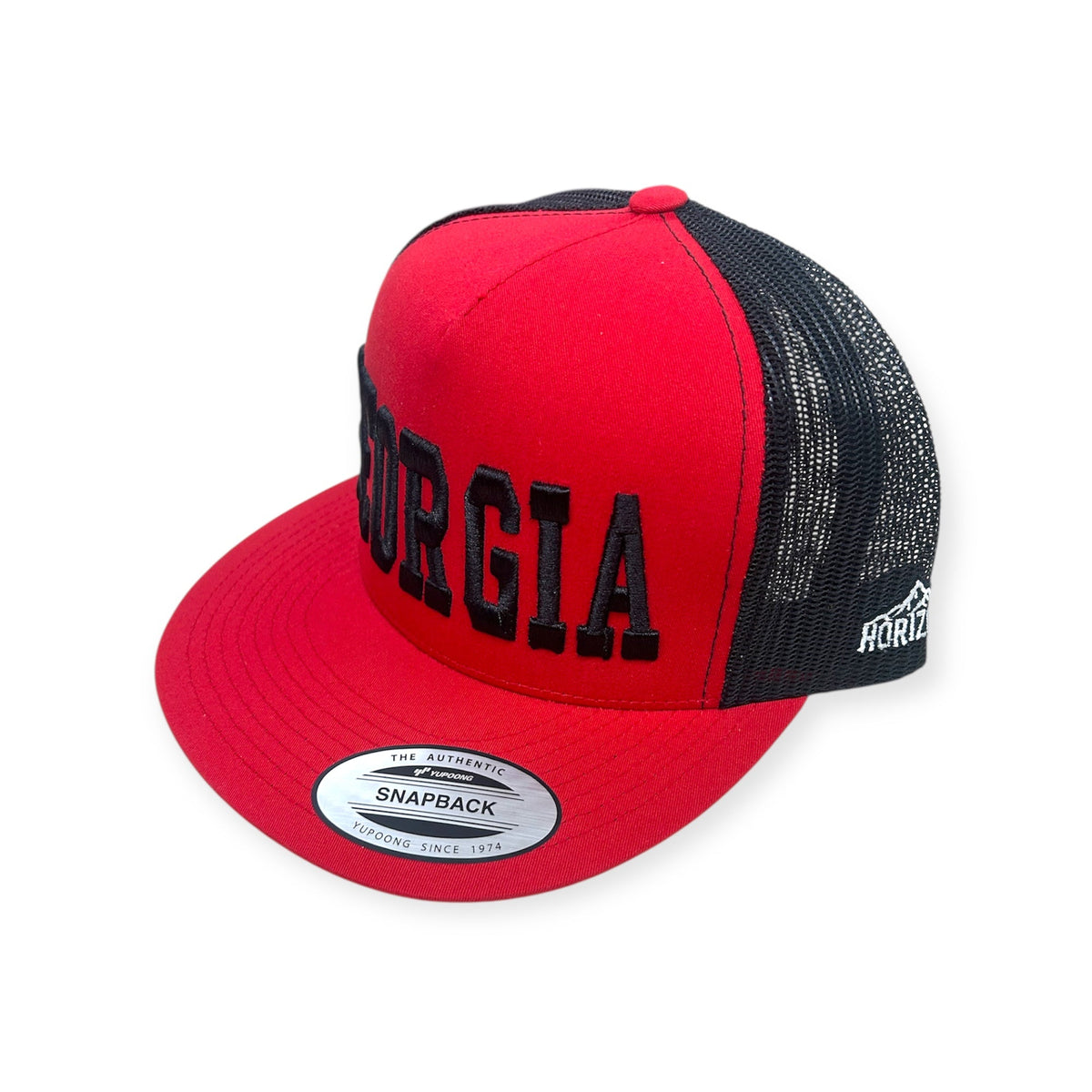 Angled view of GEORGIA Vintage embroidered cap by Horizon Hat Co. in red/black showing the bill and side panels