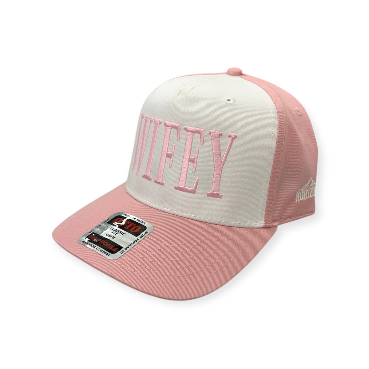 Angled view of Wifey embroidered cap by Horizon Hat Co. in natural/pink showing the bill and side panels