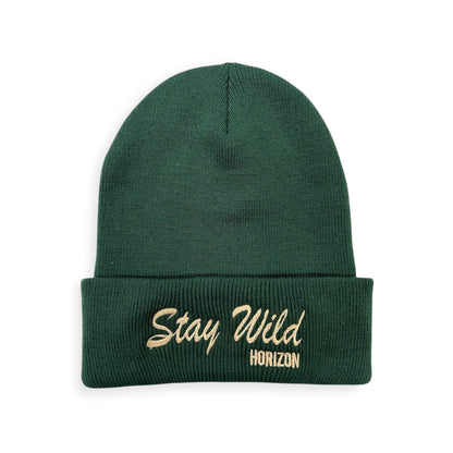 Stay Wild knit beanie by Horizon Hat Co. in green showing the stitched lettering