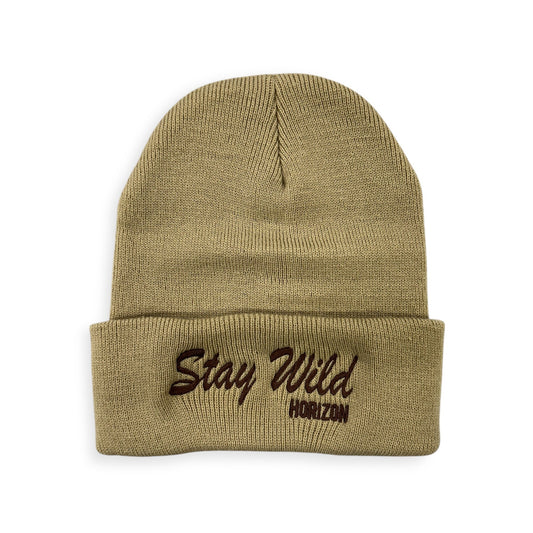 Stay Wild knit beanie by Horizon Hat Co. in tan showing the stitched lettering