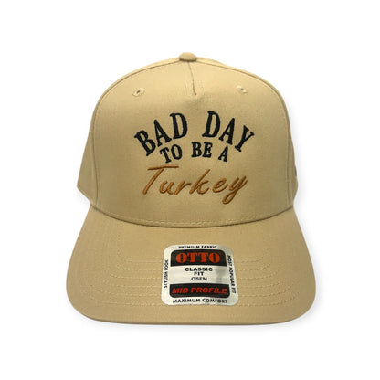 Front view of Bad Day to Be a Turkey embroidered cap by Horizon Hat Co. in khaki showing bad day to be a turkey front embroidery