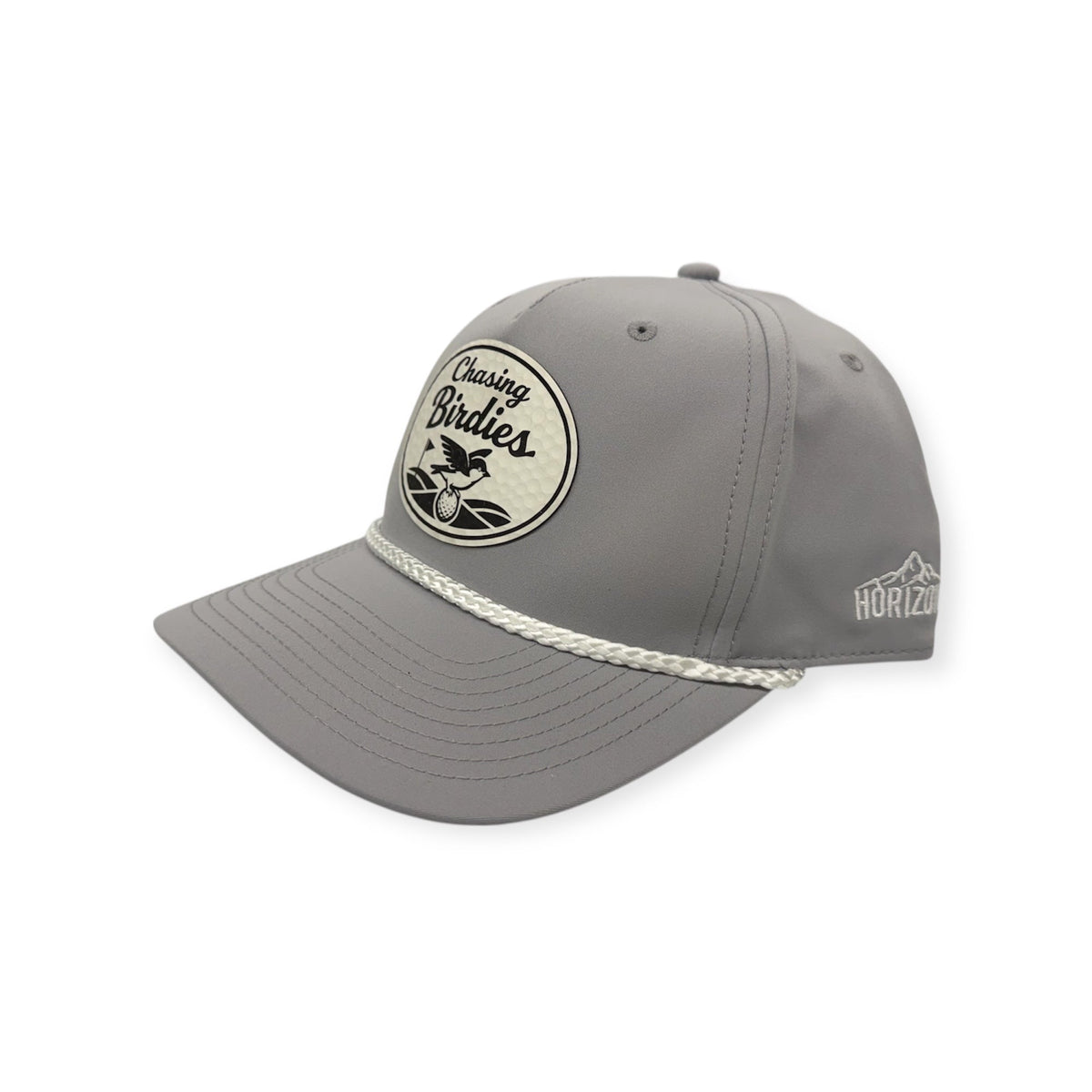 Angled view of Chasing Birdies patch hat by Horizon Hat Co. in light gray/white showing the rope detail and curved bill
