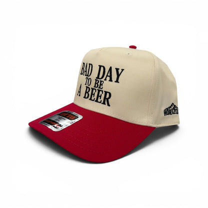 Angled view of the red-bill Bad Day to Be a Beer cap