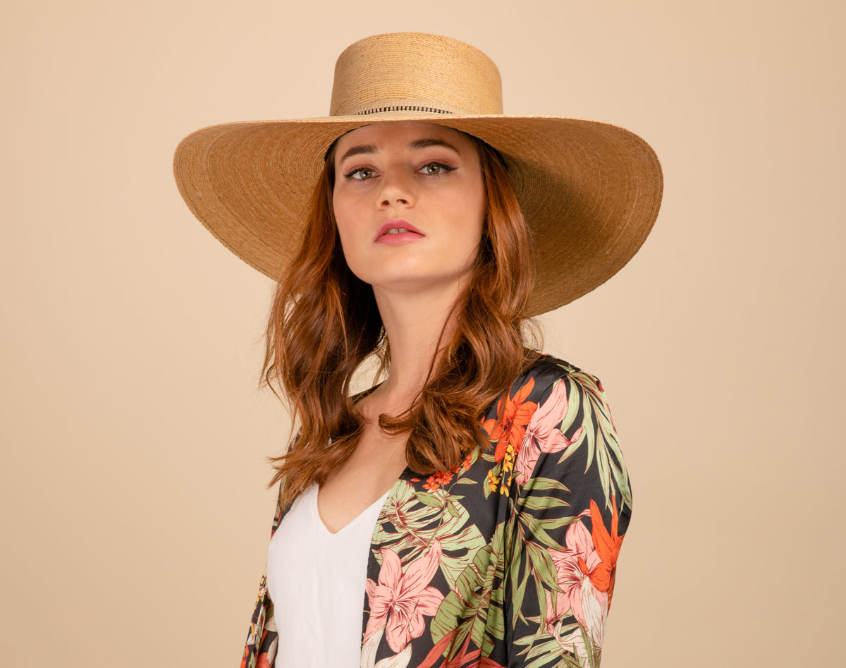 ASN Hats Rosalia natural boater hat, worn by a model in a floral outfit