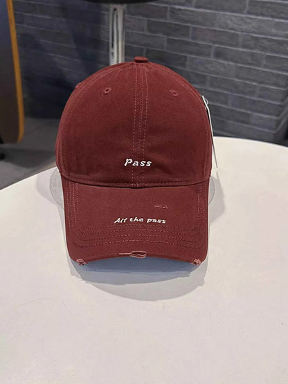 Cream white distressed baseball cap slogan detail