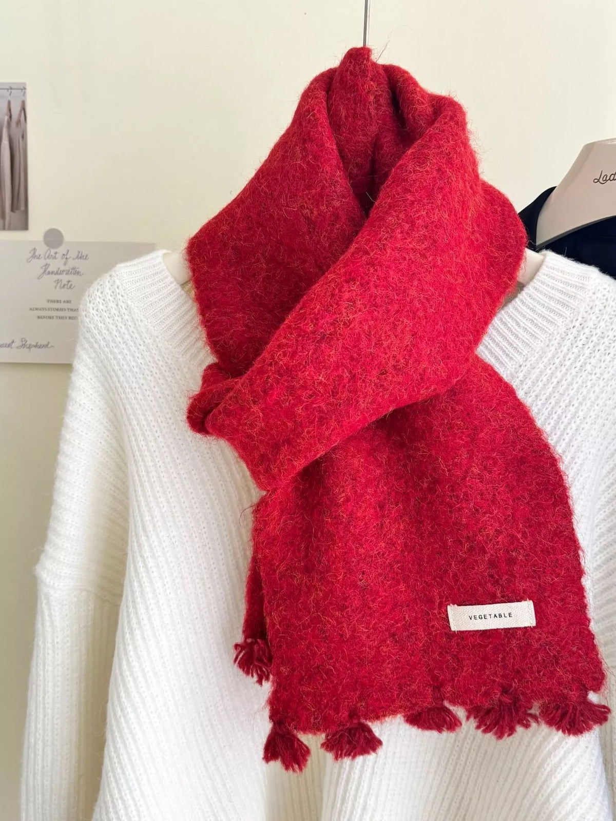 Unisex Tassel Knitted Scarf — scarlet scarf loosely tied over light knitwear