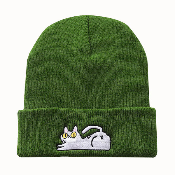 Green acrylic beanie with a reclining cat embroidered on the cuff