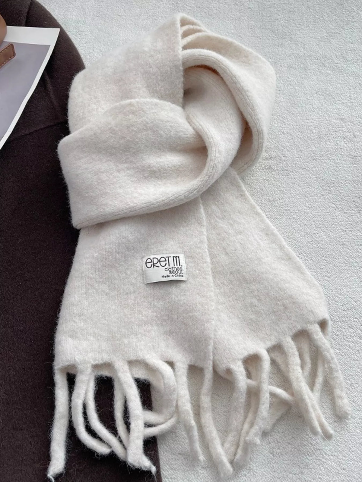 Unisex Fringe Solid Color Scarf — 70.9-Inch — ivory scarf looped on a neutral background