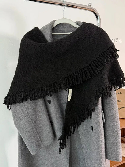 Women's Fringe Knit Triangle Wrap — black fringed triangle wrap draped over a gray cardigan