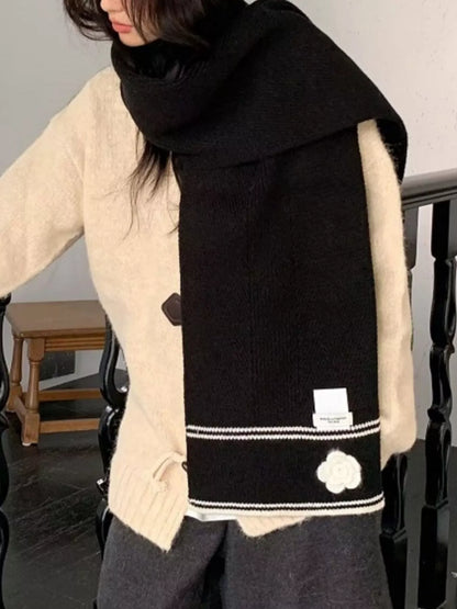 Women's Contrast Trim Knitted Scarf with Camellia Decor — black floral scarf wrapped over light knitwear