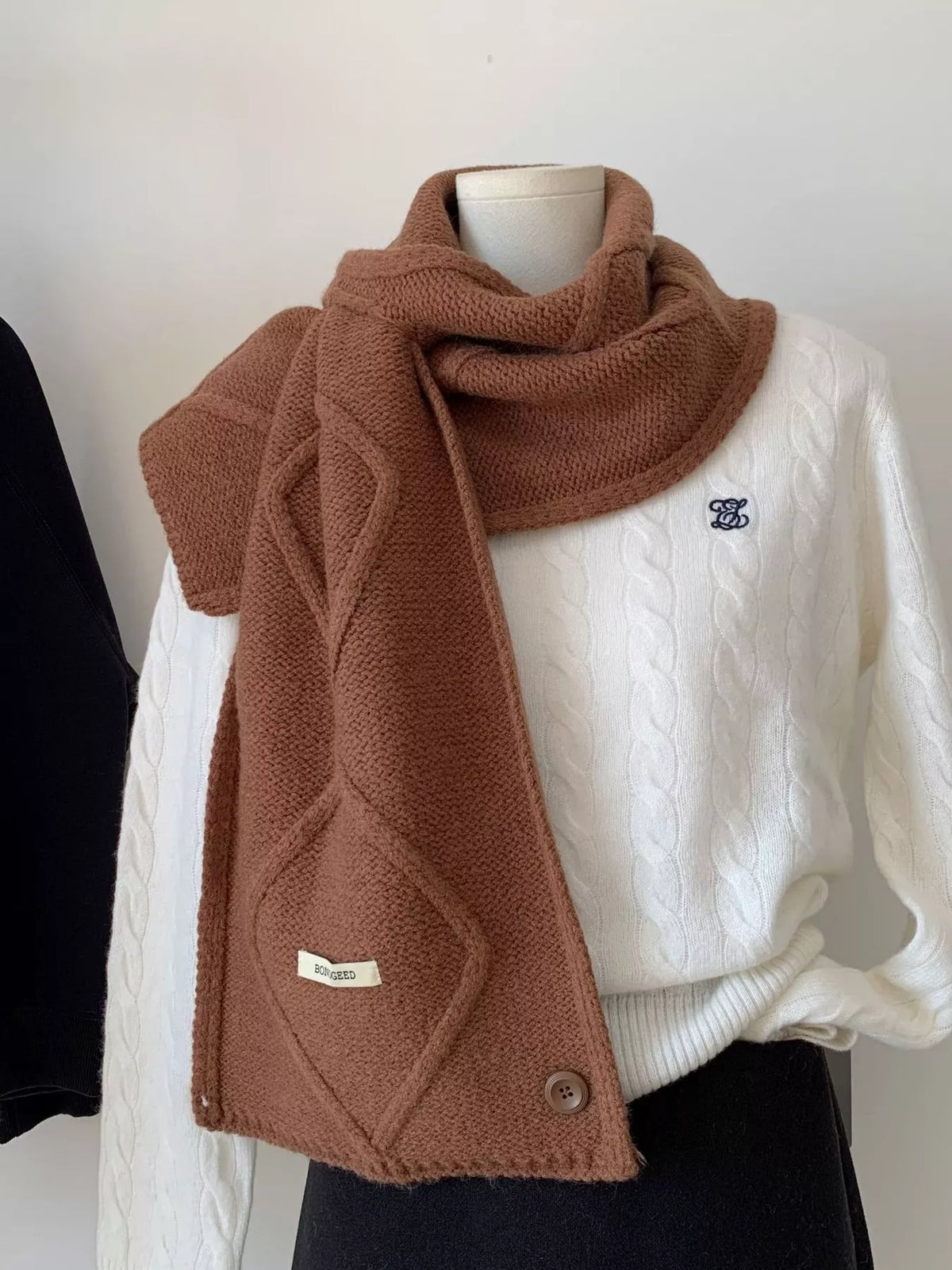 Unisex Solid Color Knitted Winter Scarf — brown winter scarf draped over light clothing
