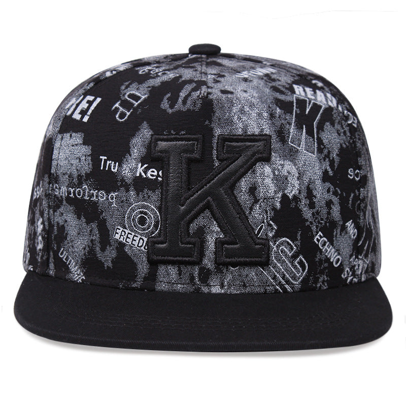 Black cotton letter K cap brim detail
