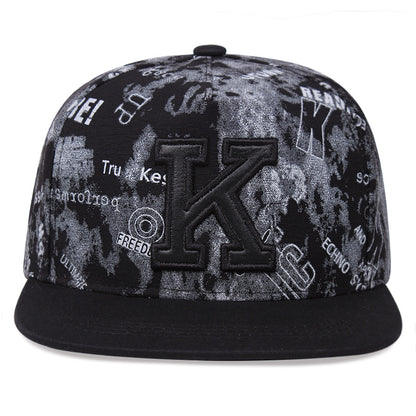 Black cotton letter K cap brim detail