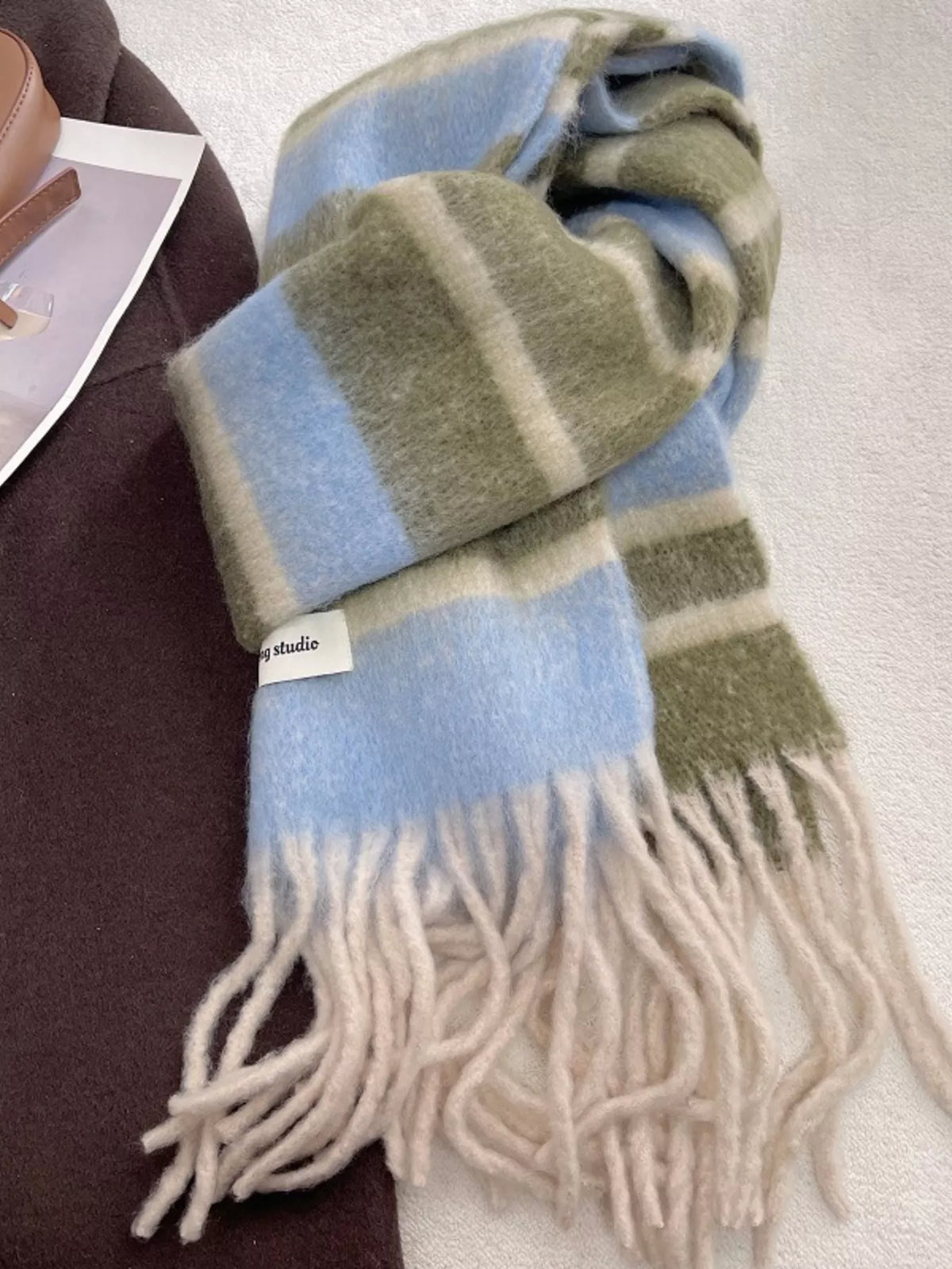 Unisex Soft Plaid Tassel Warm Scarf — blue and green checked scarf looped on a surface
