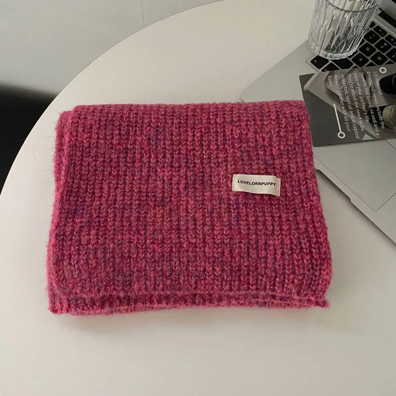 Unisex Marled Wool Blend Scarf — rose red scarf folded on a pale surface