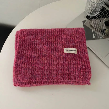 Unisex Marled Wool Blend Scarf — rose red scarf folded on a pale surface