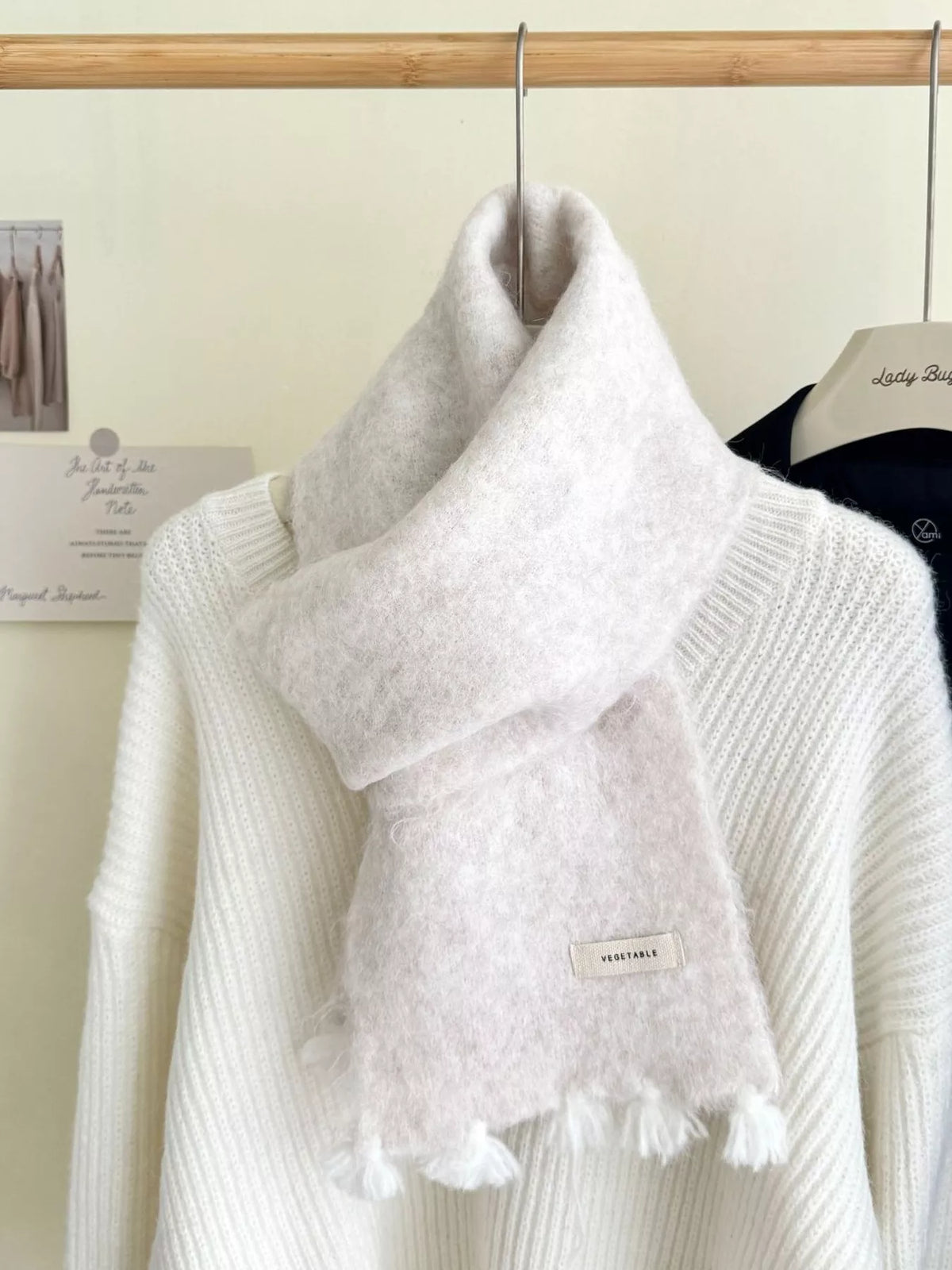 Unisex Tassel Knitted Scarf — white tasseled scarf draped over a cream sweater