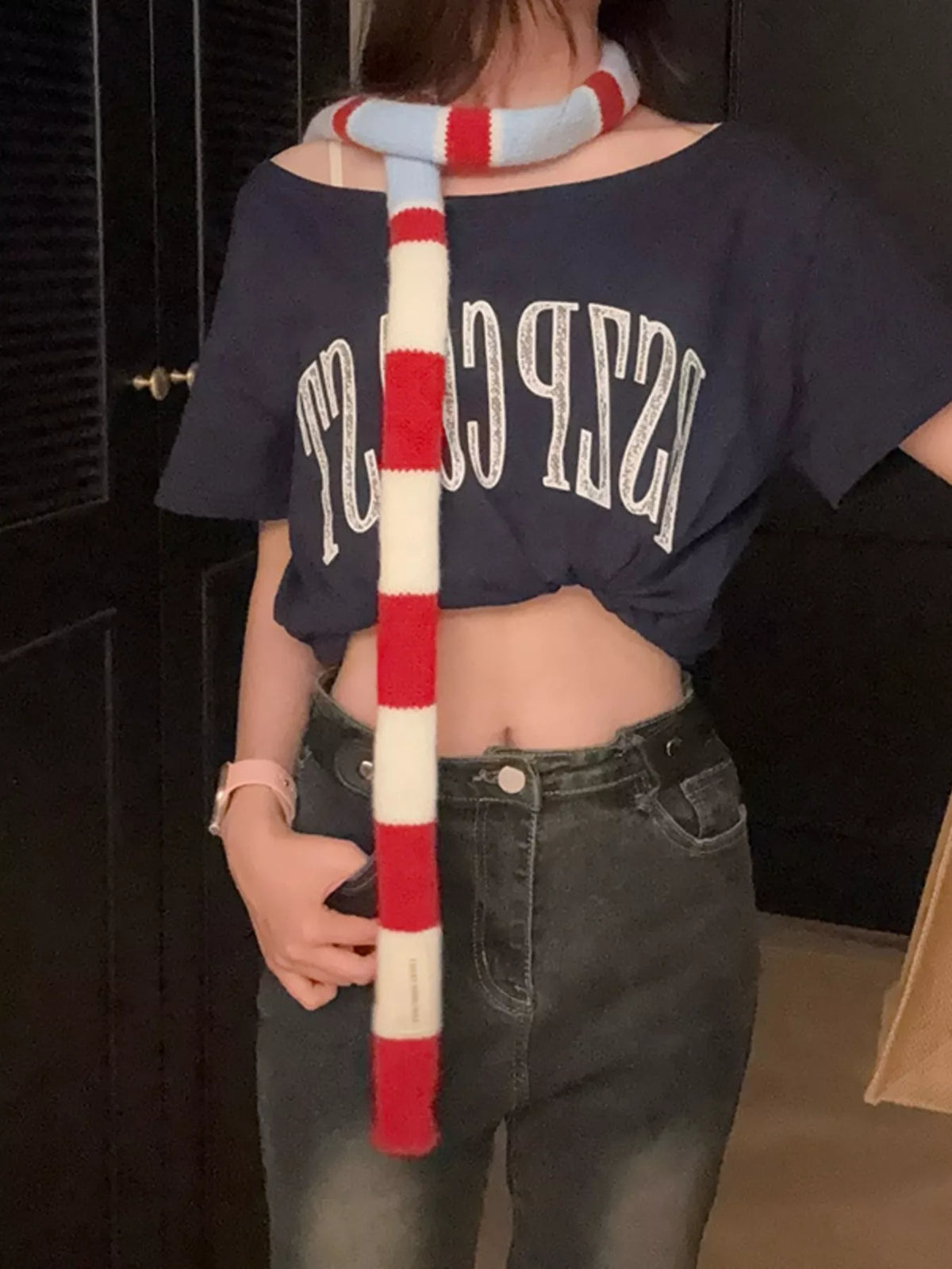 Unisex Red Stripe Skinny Scarf — skinny scarf worn open over a dark casual top