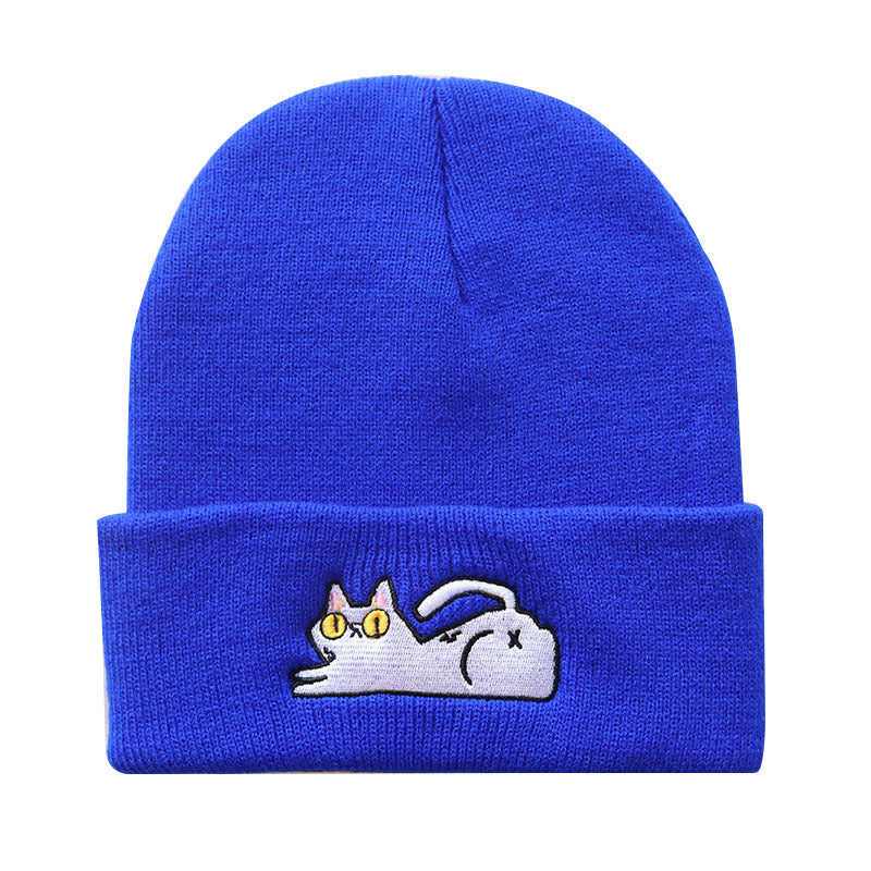 Royal blue knit beanie with a white cat motif