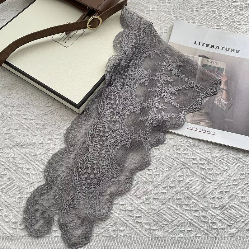 Women's Cotton Lace Neck Scarf — gray floral lace scarf laid along a pale surface
