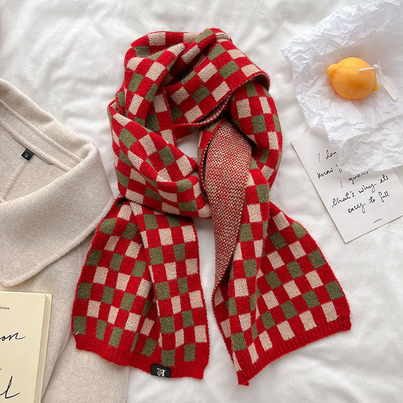 Red and light gray checkerboard knit scarf shown wrapped