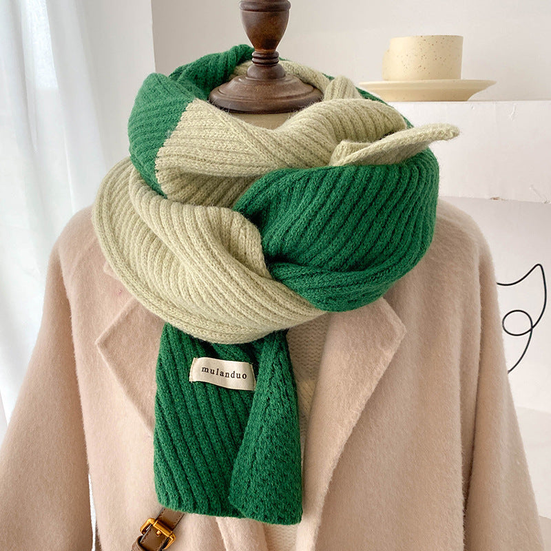 Unisex Two-Tone Ribbed Knit Winter Scarf — green and cream ribbed scarf looped over a beige coat