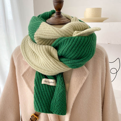 Unisex Two-Tone Ribbed Knit Winter Scarf — green and cream ribbed scarf looped over a beige coat