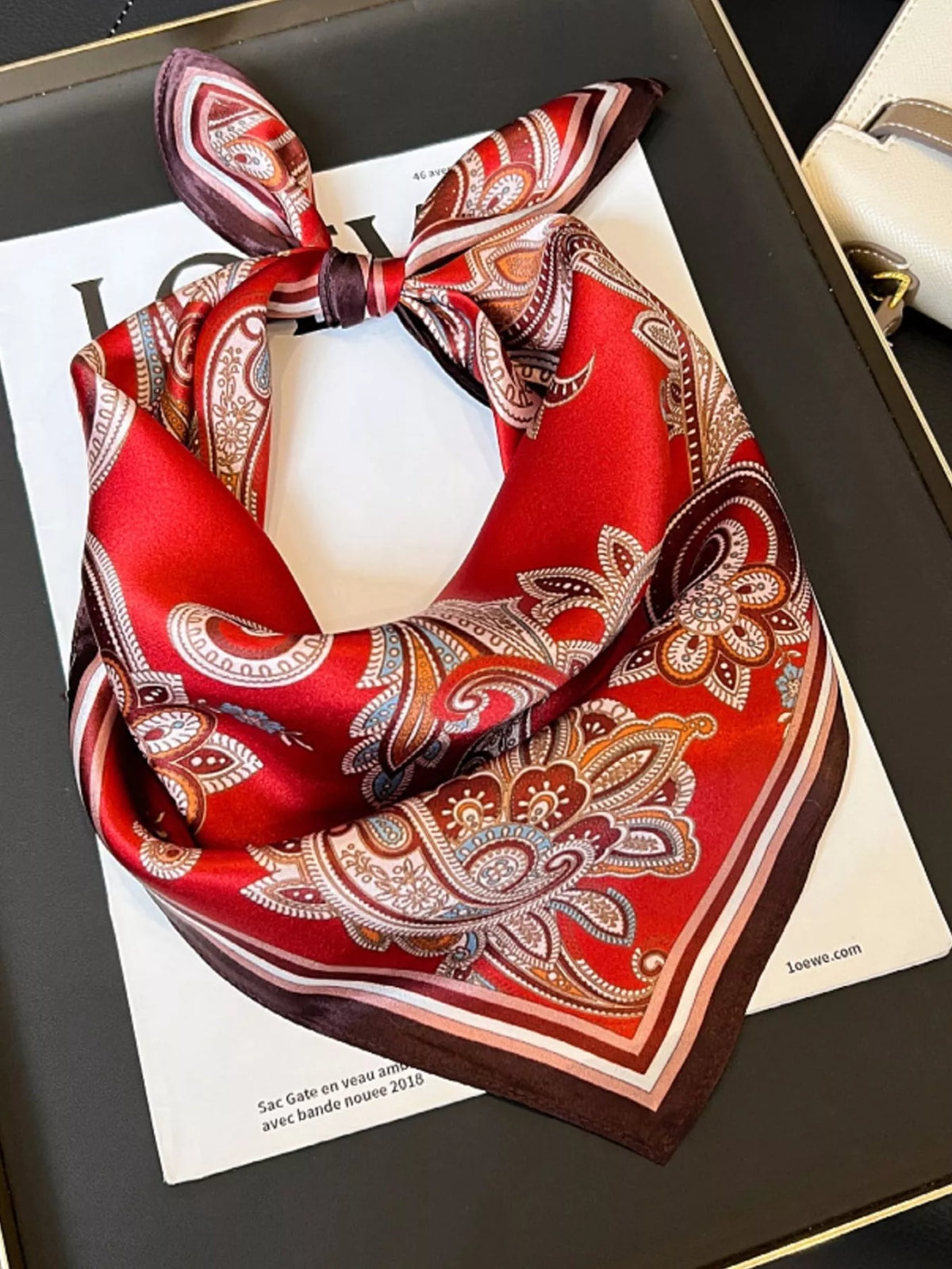 Unisex Vintage Paisley Silk Scarf — red paisley silk scarf tied with ornate motifs visible